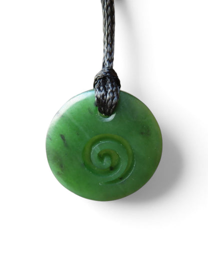 ROUND GREENSTONE PENDANT WITH KORU CARVED INTO IT