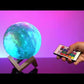 Galaxy Moon Touch Lamp  Mesmerising galaxy moon touch lamp Explore 16 different colours through the touch sensor to create the perfect ambience for any occasion Includes: USB cable for convenient recharging, remote control, wooden stand and user manual  https://snazzigifts.co.nz/products/galaxy-moon-touch-lamp