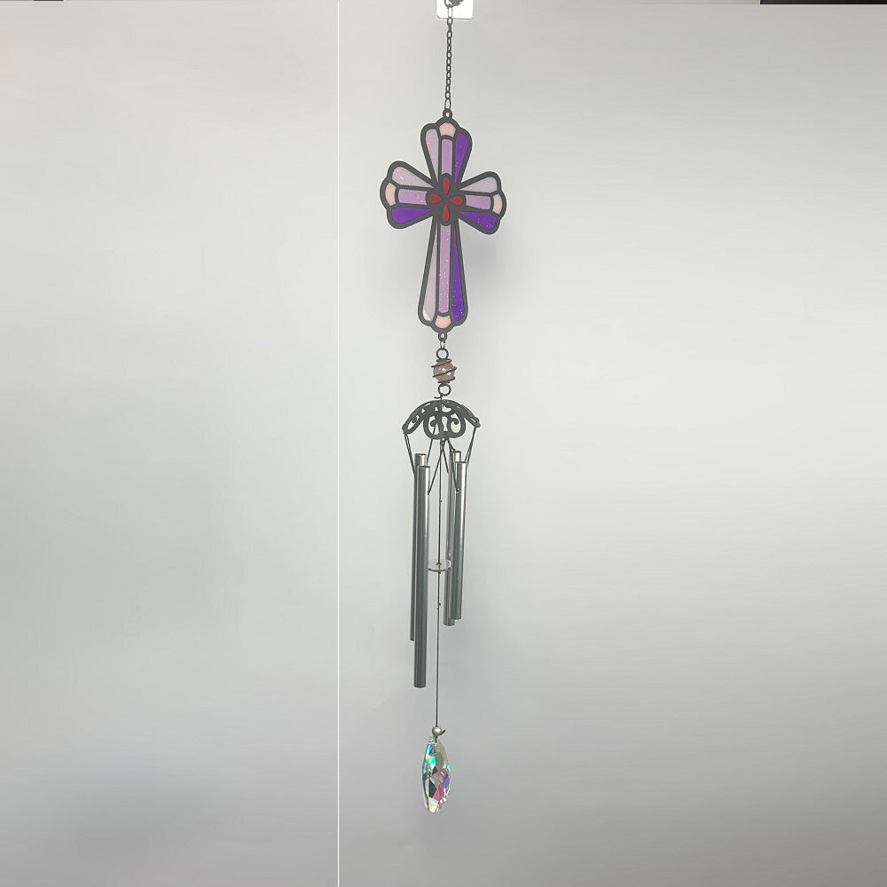Cross Wind Chime 25" NEW! Enjoy the relaxing sounds of wind chimes as a gentle breeze passes through this beautiful resin wind chime. This makes a sweet-sounding addition to any yard or garden.